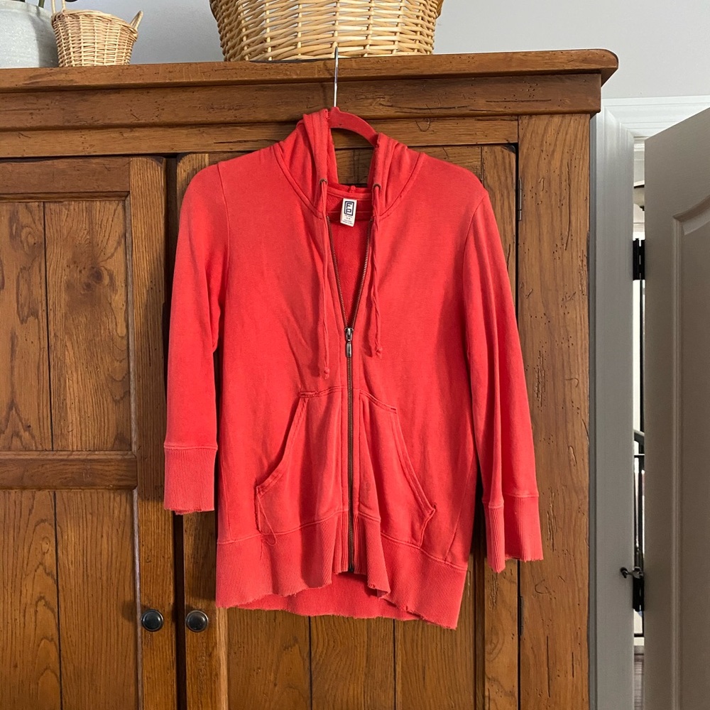 Free People quarter length sleeve jacket. NWOT. Orange. Designed to look worn.